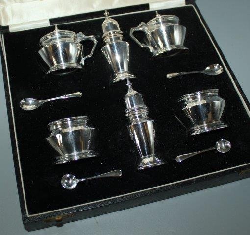 Silver cruet set in case